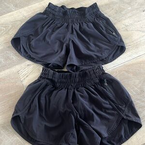 Lululemon track that mid rise shorts in black size 4 set of two